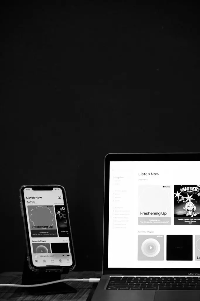a laptop computer sitting on top of a wooden desk